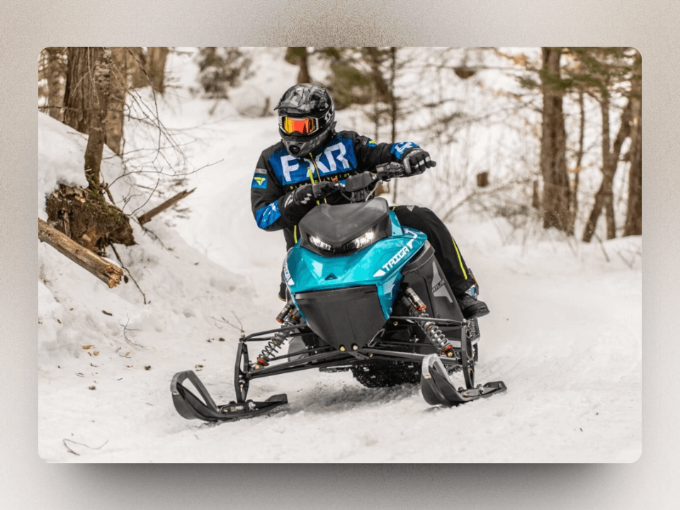Atlas Taiga electric snowmobile with a blue colour and great suspension system.