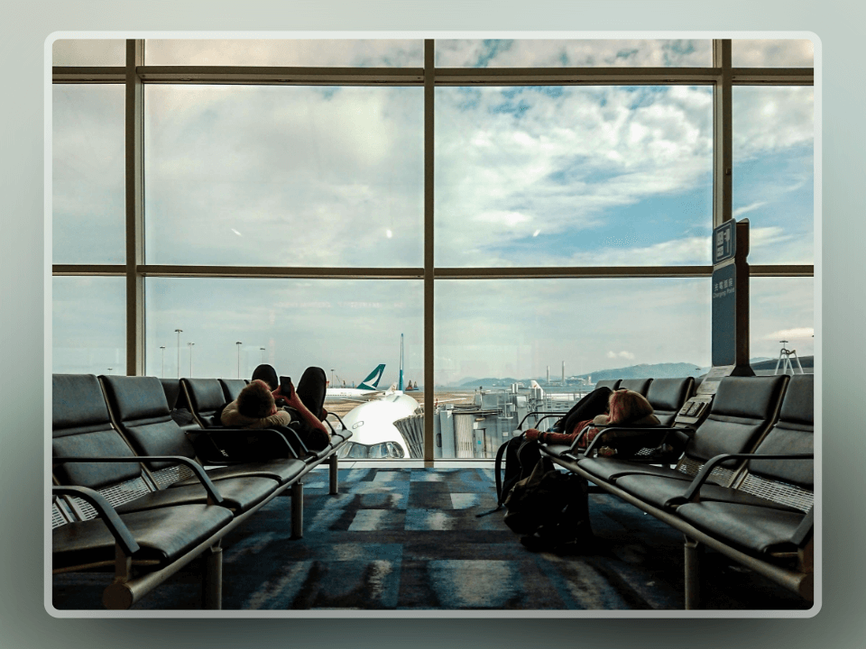 people waiting in airport and sleeping during daytime